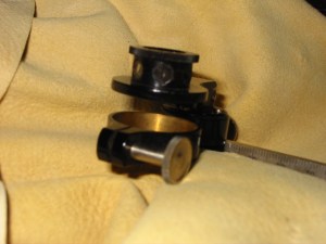 The upper portion with filters to limit light sent to the eyepiece reflector.