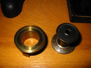 The left portion contains no optical components and is little more than a mounting collar.